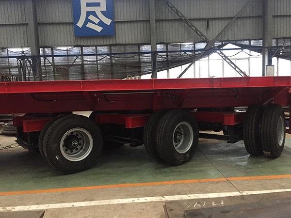 Extendable-flatbed-trailer-with-steering-axles